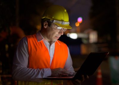 Portrait of handsome Persian man construction worker on the construction site at night Portrait of handsome Persian man construction worker on the construction site at night horizontal shot